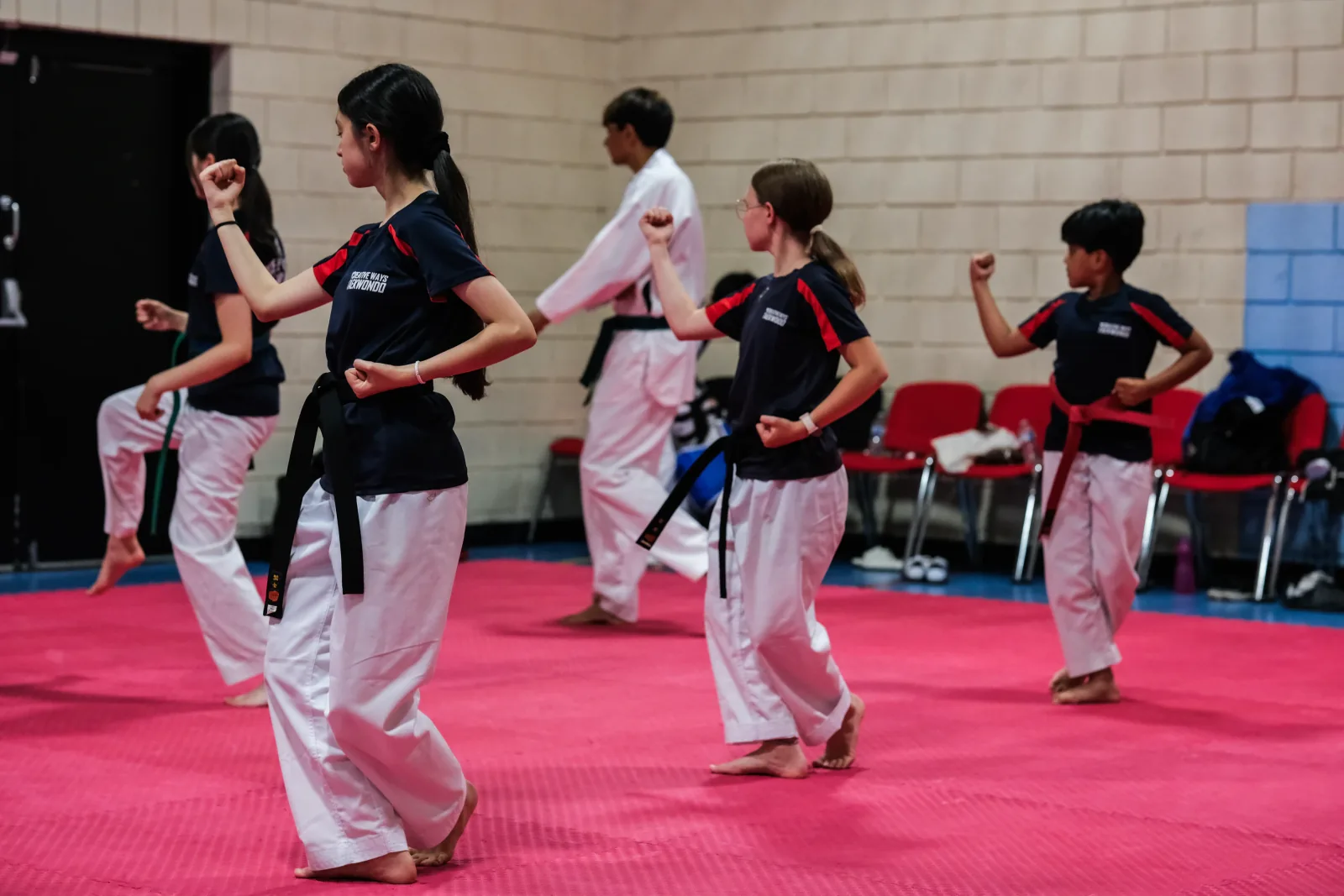 Creative Ways Taekwondo students practising poomsae during class